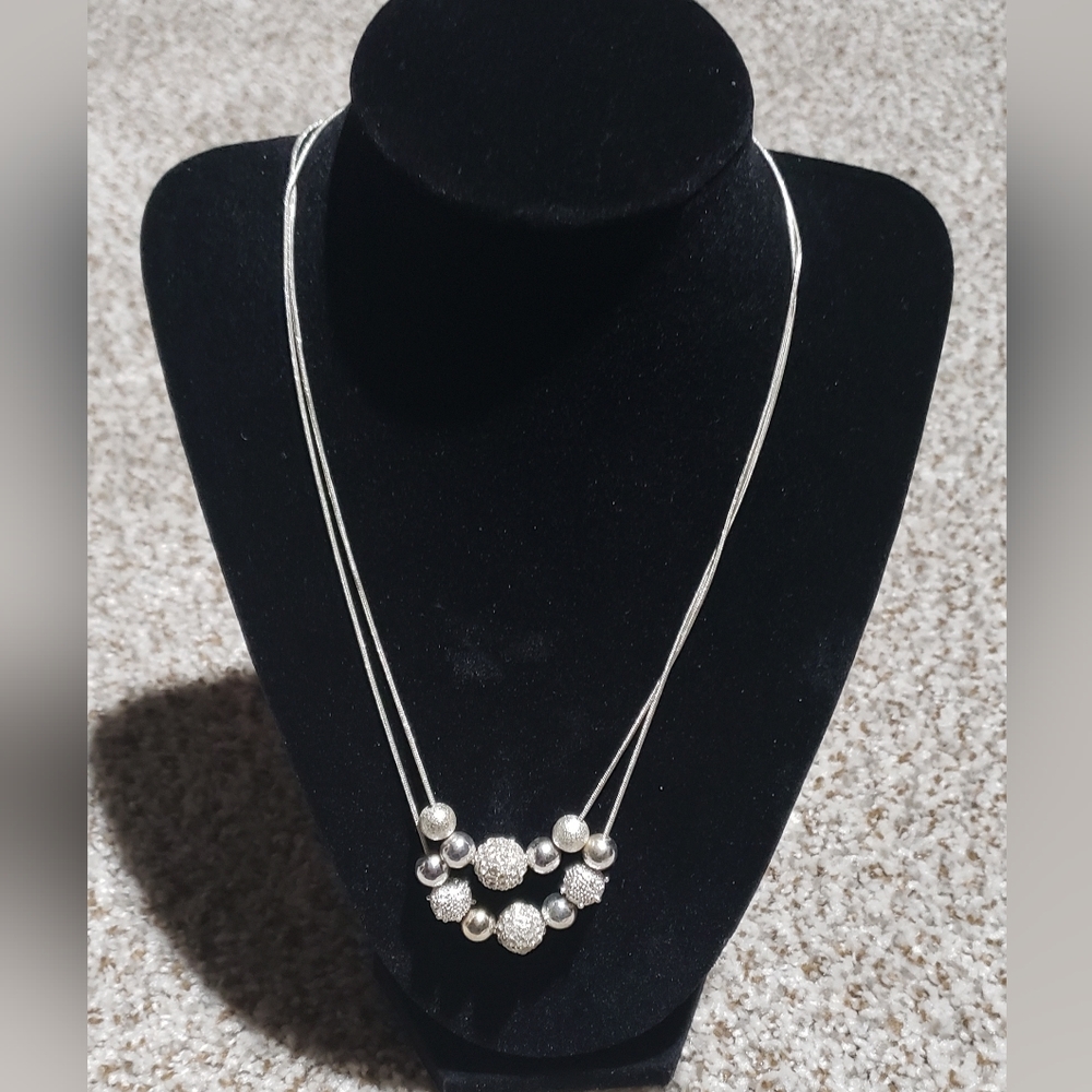 Silvertone double necklace with shamballa beads.